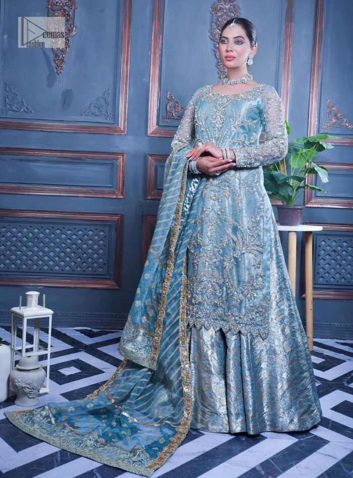 Serving looks we love. DeemasFashion presents this party outfit in sky blue colour which is adorned with silver embroidery and further prominent with tilla, dabka, kora, Kundan, Zardozi and the real magic of crystals. The round neckline looks like a complete diva since it is so opulent and vibrant. Further, the full sleeves make this masterpiece lovely and charming. It is organized with lehenga made with pure jamawar which speaks for itself. Complete this outfit with a dupatta framed with four-sided borders that have been carefully added for the additional finishing touch.