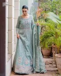 The fused lehenga is offered in a rich, sophisticated colour palette, ensuring you steal the spotlight with your regal presence.