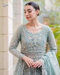 Introducing our stunning sky-blue Walima outfit, a masterpiece of artistry and elegance. This attire showcases a harmonious fusion of traditional and modern design elements, adorned with intricate silver embellishments that include tilla, dabka, kora, Kundan and the real magic of Zardozi.