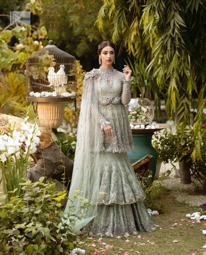 The flowing peplum jewel neckline is coordinated with double layers of lehenga to ensure a comfortable and stunning fit, while the rich colour palette exudes timeless charm.