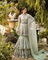The flowing peplum jewel neckline is coordinated with double layers of lehenga to ensure a comfortable and stunning fit, while the rich colour palette exudes timeless charm. Our Nikah outfit is the perfect choice for those seeking a blend of tradition and contemporary style, making you the center of attention on your memorable occasion.