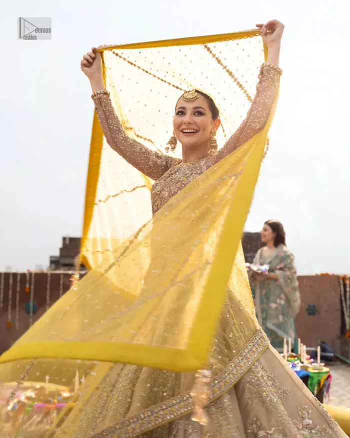 The blouse is crafted with multiple color embroidery which involves tilla, dabka, kora, Kundan, and Zardozi, this ensemble features lively patterns and intricate embellishments, adding a touch of tradition to your special day.
