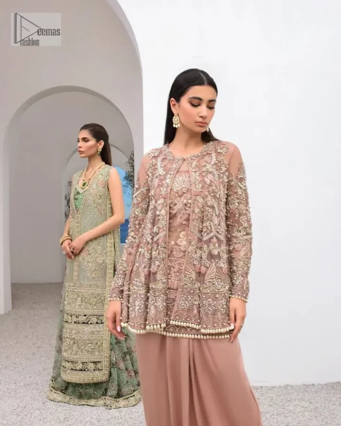 Rich shades and stunning details of party outfit – you’ll be making heads turn. A 2 pc outfit with a short front open shirt, full sleeves with floral pattern and embellishments on organza fabric; the asymmetrically placed designs are studded with golden and silver embroidery which is further highlighted with tilla, dabka, kora, Kundan and the intricate details of Zardozi. The embellished neckline has the finest details. It is paired up with the inner shirt that is also embellished to make this luxury attire unique. To complete the outfit the plain lehenga paired, just to fulfil your diva look.