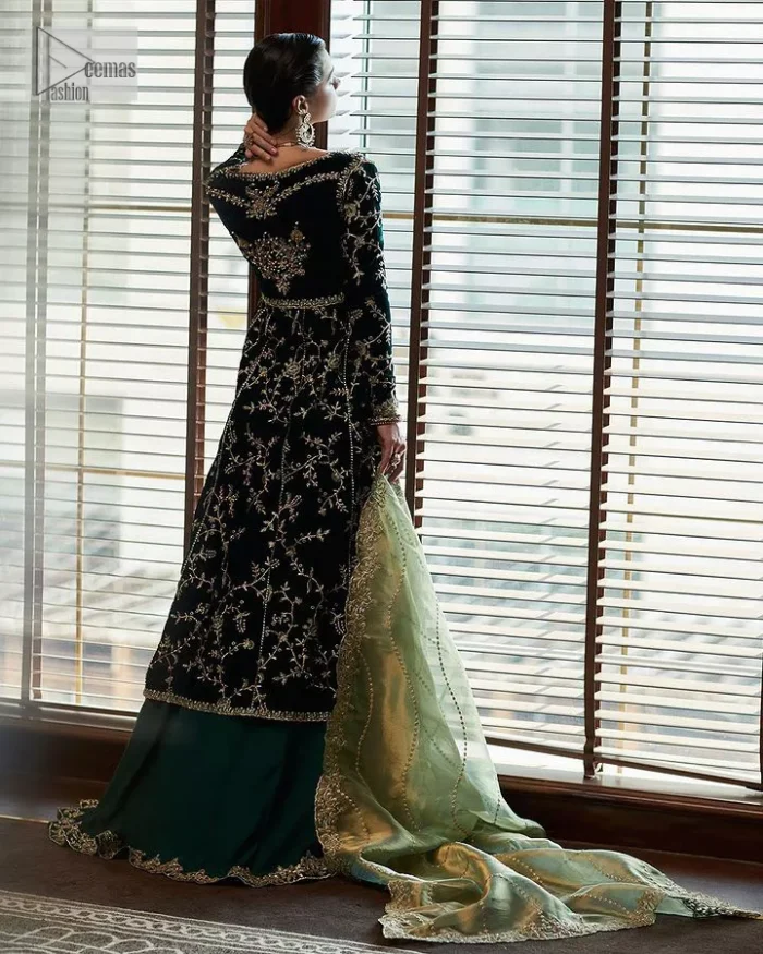 Outfits that define you. DeemasFashion presents the party wear in deep green colour which is adorned with light golden embroidery. It is enhanced with tilla, dabka, kora Kundan and the real magic of Zardozi. The round neckline makes this epitome of beauty. Furthermore, the full sleeves of the front open gown intensify the beauty of the outfit. It is coordinated with a plain lehenga with a border embellished to make you feel fresh and bold at the same time. Complete this attire with a dupatta in ivory colour which is ornamented with a four-sided embellished border to give a royal touch.