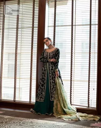 Outfits that define you. DeemasFashion presents the party wear in deep green colour which is adorned with light golden embroidery. It is enhanced with tilla, dabka, kora Kundan and the real magic of Zardozi. The round neckline makes this epitome of beauty. Furthermore, the full sleeves of the front open gown intensify the beauty of the outfit. It is coordinated with a plain lehenga with a border embellished to make you feel fresh and bold at the same time. Complete this attire with a dupatta in ivory colour which is ornamented with a four-sided embellished border to give a royal touch.