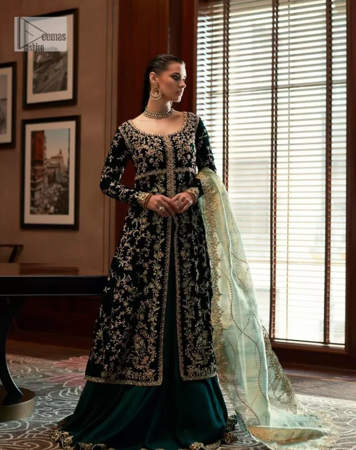 Outfits that define you. DeemasFashion presents the party wear in deep green colour which is adorned with light golden embroidery. It is enhanced with tilla, dabka, kora Kundan and the real magic of Zardozi. The round neckline makes this epitome of beauty. Furthermore, the full sleeves of the front open gown intensify the beauty of the outfit. It is coordinated with a plain lehenga with a border embellished to make you feel fresh and bold at the same time. Complete this attire with a dupatta in ivory colour which is ornamented with a four-sided embellished border to give a royal touch.