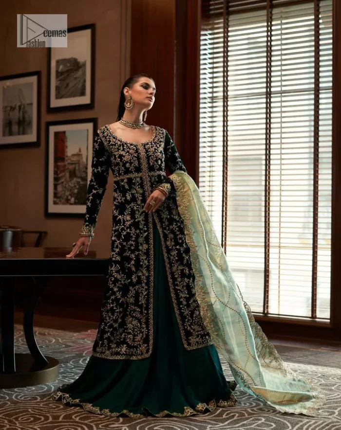 Outfits that define you. DeemasFashion presents the party wear in deep green colour which is adorned with light golden embroidery. It is enhanced with tilla, dabka, kora Kundan and the real magic of Zardozi. The round neckline makes this epitome of beauty. Furthermore, the full sleeves of the front open gown intensify the beauty of the outfit. It is coordinated with a plain lehenga with a border embellished to make you feel fresh and bold at the same time. Complete this attire with a dupatta in ivory colour which is ornamented with a four-sided embellished border to give a royal touch.