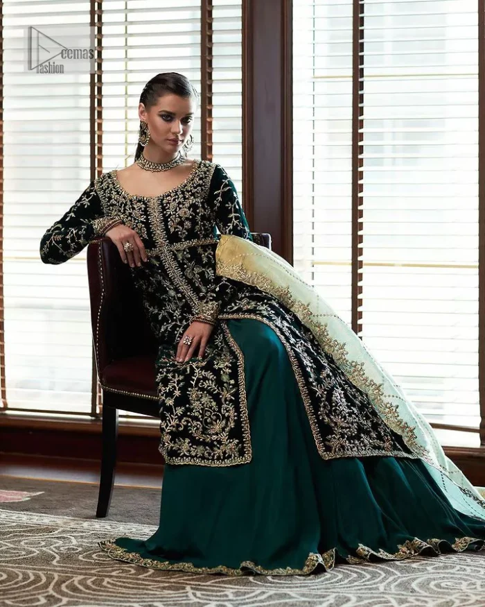 Outfits that define you. DeemasFashion presents the party wear in deep green colour which is adorned with light golden embroidery. It is enhanced with tilla, dabka, kora Kundan and the real magic of Zardozi. The round neckline makes this epitome of beauty. Furthermore, the full sleeves of the front open gown intensify the beauty of the outfit. It is coordinated with a plain lehenga with a border embellished to make you feel fresh and bold at the same time. Complete this attire with a dupatta in ivory colour which is ornamented with a four-sided embellished border to give a royal touch.