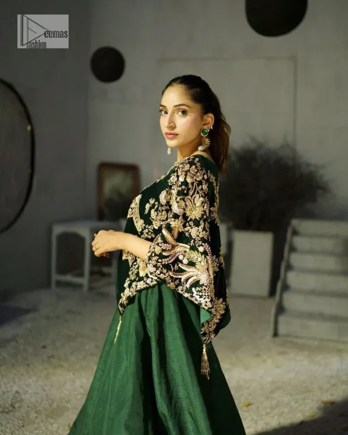 Style. Warmth. Performance & versatility!  This stuns in a beautifully handcrafted green top enshrined with light golden embellishment and detailed intricate floral & geometric patterns. The round neckline enhances the beauty of the outfit. Further, the floral designs on the sleeves make this outfit unique and attractive. It is coordinated with a plain organza lehenga in the same colour to balance your overall outfit. Collectively, this ensemble is the true essence of DeemasFashion bridals.