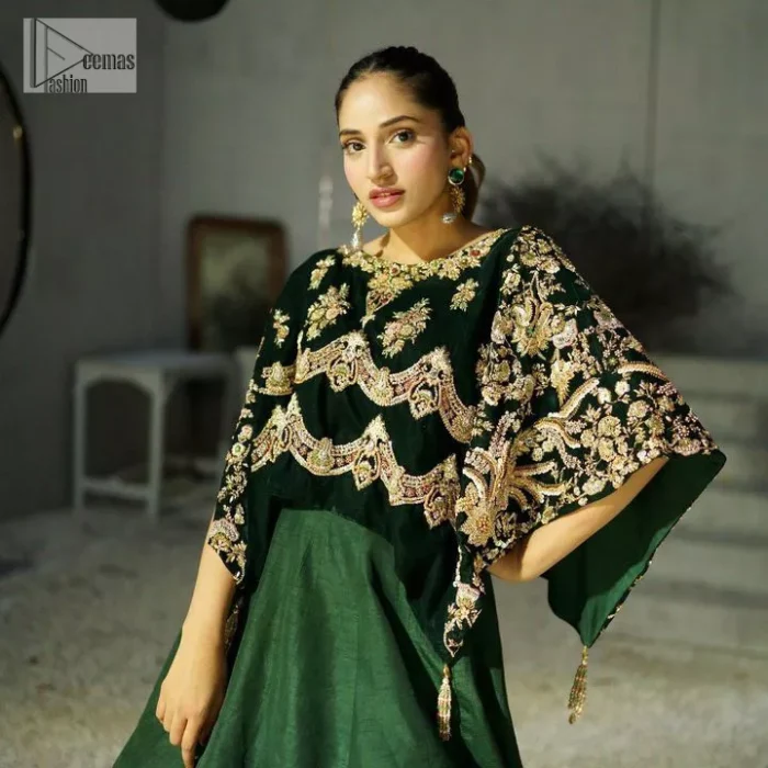 Style. Warmth. Performance & versatility!  This stuns in a beautifully handcrafted green top enshrined with light golden embellishment and detailed intricate floral & geometric patterns. The round neckline enhances the beauty of the outfit. Further, the floral designs on the sleeves make this outfit unique and attractive. It is coordinated with a plain organza lehenga in the same colour to balance your overall outfit. Collectively, this ensemble is the true essence of DeemasFashion bridals.