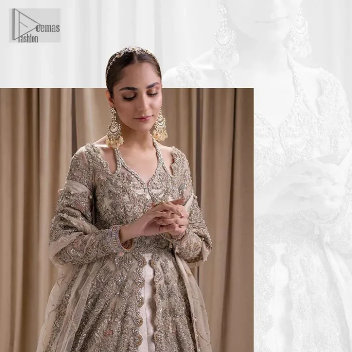Make a statement with a light fawn article on your nikah day! DeemasFashion presents the light fawn heavy maxi which is embellished with silver embroidery using dabka, tilla, kora, Zardozi, Swarovski, Mukesh, sequin and Kundan. The strap neckline adds a little romanticness to the dress. Further, the floral patterns on full sleeves make this masterpiece modern and unique. It is paired with a  lehenga, embellished with a delicate border. It is styled with a dupatta; its surface is sprayed with sequin and the dupatta is enveloped by a heavily embellished floral border.