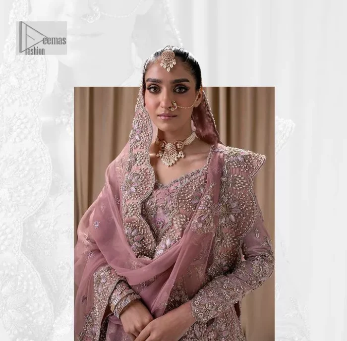 Stand out and stay pink with this nikah wear! The delightful article in pink colour is a traditional masterpiece that will give the gorgeous bride a head-turning look at the wedding. The frock has a sweetheart neckline to make this outfit lovely. It is adorned with silver and golden embroidery which is magnified with tilla, dabka, Koran, Kundan and the details of Zardozi. Further, the combination of tiny and large floral motifs on full sleeves provides a perfect finishing look to this masterpiece. It is paired up with a lehenga in the same colour making it an epitome of beauty and grace. Finish this with a dupatta framed with four-sided embellished scalloped borders and tiny floral motifs all over.