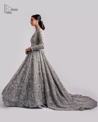The beautiful mint green reception wear is a breathtaking masterpiece that will give you a magnificent look at the wedding. Lavish embroidery work and hand-crafted embellishments provide a perfect finishing look to this pishwas. It is adorned with silver embroidery which involves tilla, dabka, kora, Kundan and the real magic of zardozi. Further, the V shape neckline makes this masterpiece unique and attractive. The full sleeves are full of floral embroidery patterns. It is paired up with a lehenga with embroidered border to balance the outfit's look. The dress achieves the final elegant look when paired with a delicate dupatta embellished with four-sided scalloped edges and tiny floral motifs all over.
