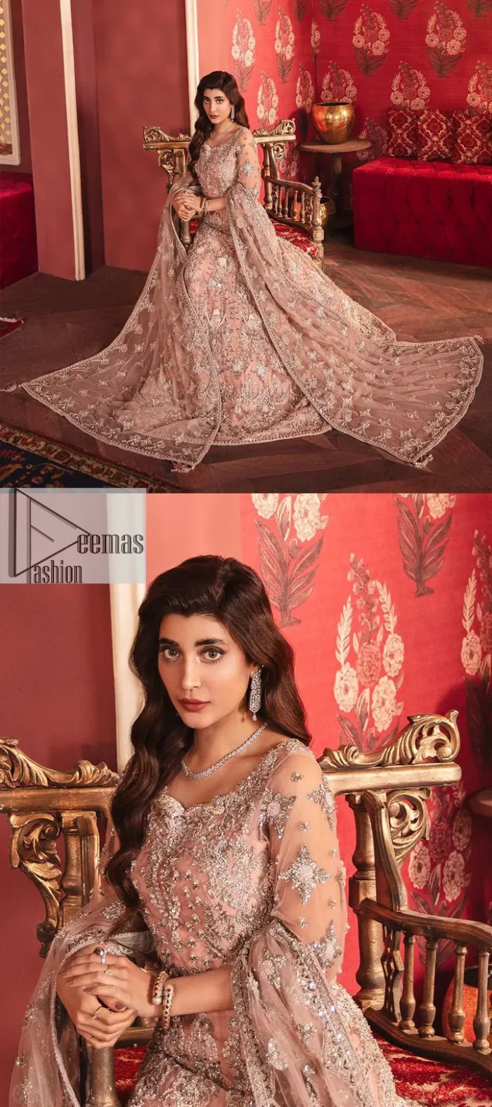 The beautiful outfit comes has an alluring peach colour and is gracefully emblazoned with embroidery. Hand-crafted details of tilla, dabka, kora, Kundan, stones, motifs, and sequins enhance the charm of this outfit. The sweetheart neckline makes this blouse a little more romantic for your walima day. Further, the floral motifs on half sleeves are just a new trend of looming on your day. It is organized with a heavy lehenga. Beaming silver work, floral designs, and lavish details give a perfect finishing look to the masterpiece. Complete this attire with a dupatta framed with a four-sided borders and floral motifs all over.