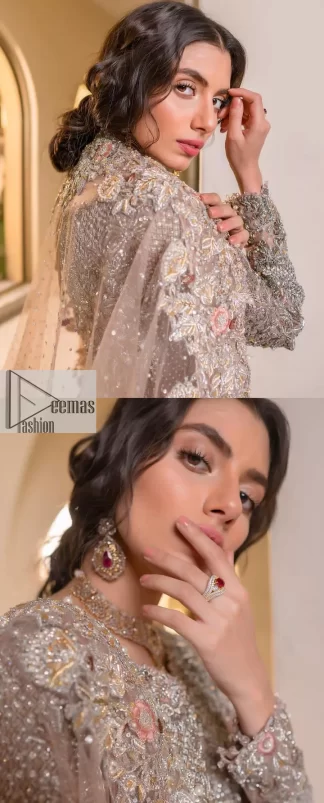 Let your nikah outfit do the talking.  An elegant rhyme to tradition, this short shirt and lehenga create aesthetical magic with its eye-catching hues of rose pink. The beautiful article shines with silver embellishments and an amalgamation of floral patterns which is enhanced with tilla, dabka, kora, Kundan and the detailing of Zardozi.  The full sleeves are heavily embroidered with floral patterns. Further, the V shape neckline makes this epitome of beauty. The lehenga is also intensified with beautiful embroidery. The perfect opulent short-shirt lehenga outfit is paired with an organza dupatta which is adorned with a four-sided embellished border and sequins sprayed all over