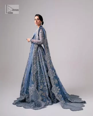 Stay blue and look your best! A sky blue lehenga choli is hand embellished with floral patterns and botanical motifs. The blouse is encrusted with silver embroidery which is enhanced with tilla, dabka, kora, Kundan and the real magic of Zardozi. The jewel neckline and full sleeves make this masterpiece lovely and charming. It is paired up with a lehenga in the same colour that has embellished on the front and back finish. Complete the walima wear with a dupatta having four-sided Kiran and tiny floral motifs all over just to complete the look.