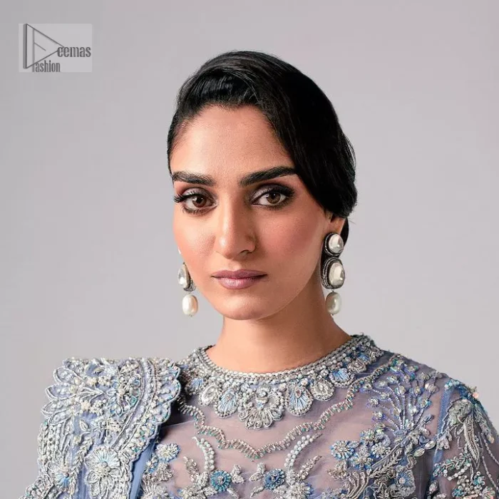 Stay blue and look your best! A sky blue lehenga choli is hand embellished with floral patterns and botanical motifs. The blouse is encrusted with silver embroidery which is enhanced with tilla, dabka, kora, Kundan and the real magic of Zardozi. The jewel neckline and full sleeves make this masterpiece lovely and charming. It is paired up with a lehenga in the same colour that has embellished on the front and back finish. Complete the walima wear with a dupatta having four-sided Kiran and tiny floral motifs all over just to complete the look.