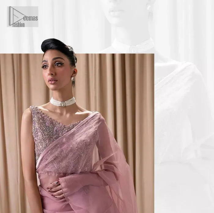 Turn heads in our stunning bridesmaid saree! The beautiful tea pink blouse is adorned with silver and golden embroidery which is intensified with tilla, dabka, kora, Kundan and the details of Zardozi. The V shape neckline provides a perfect finishing look to this masterpiece. In addition to this, the sleeveless style of the following blouse makes this outfit unique and romantic. It is paired up with a frilled saree which is plain just to enhance the beauty of this lovely outfit. 