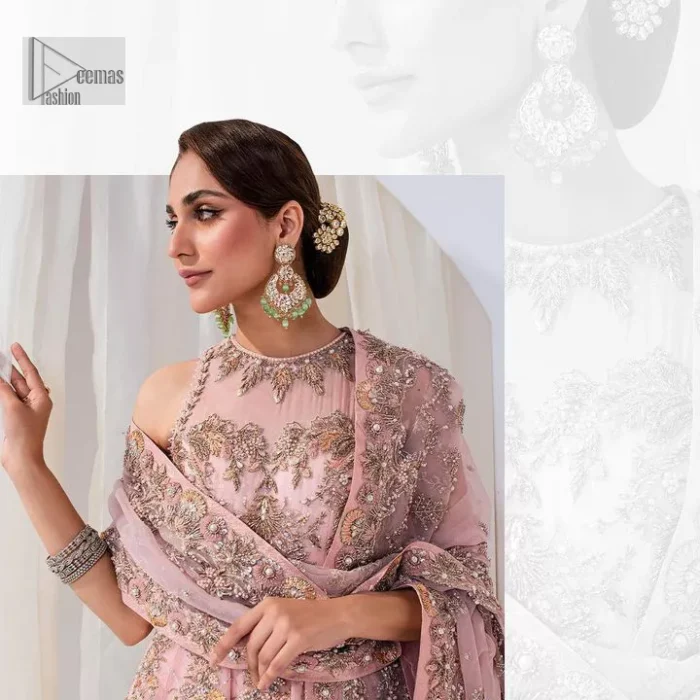 Matching embellishments are here to stay. The attractive tea pink nikah article is a stunning attire adorned with tilla, dabka, kora, Kundan, Zardozi and Gota.  Hand-crafted embellishments of golden and silver embroidery and floral patterns give a perfect finishing look to the maxi. The following scalloped maxi has a jewel neckline to make this unique and charming. In addition to this, the sleeveless style of the maxi is a breathtaking masterpiece that will give the gorgeous bride a breathtaking traditional look at the wedding. It is paired up with a plain lehenga to balance the astonishing look. Finish this with a dupatta that has four-sided embellished borders and tiny floral motifs all over to make your day glow and flowery.