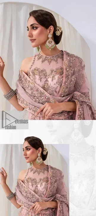 Matching embellishments are here to stay. The attractive tea pink nikah article is a stunning attire adorned with tilla, dabka, kora, Kundan, Zardozi and Gota.  Hand-crafted embellishments of golden and silver embroidery and floral patterns give a perfect finishing look to the maxi. The following scalloped maxi has a jewel neckline to make this unique and charming. In addition to this, the sleeveless style of the maxi is a breathtaking masterpiece that will give the gorgeous bride a breathtaking traditional look at the wedding. It is paired up with a plain lehenga to balance the astonishing look. Finish this with a dupatta that has four-sided embellished borders and tiny floral motifs all over to make your day glow and flowery.