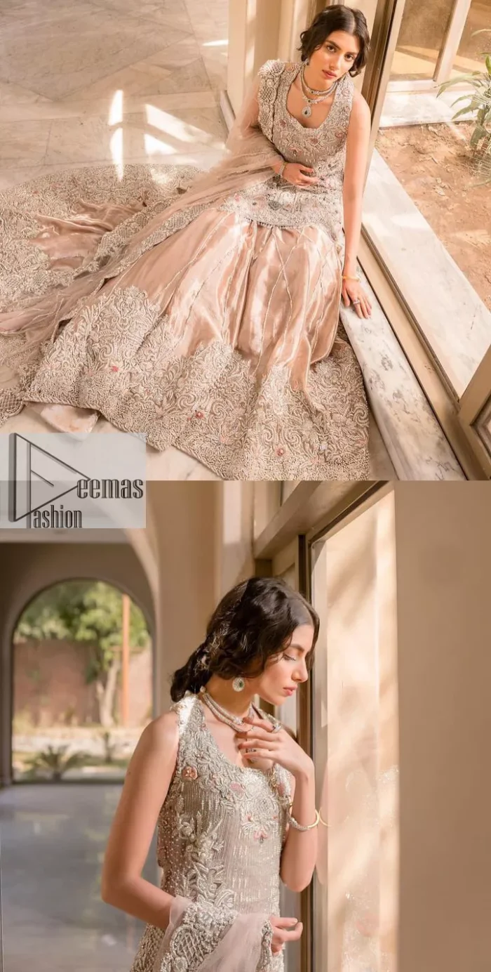 The beauty of idealism is captured with a touch of sparkle. This exclusive rose pink ensemble is beautifully translated on rose pink canvas, which makes this walima outfit stand out in the crowd. This fully embellished article comes with a short shirt lehenga style that gives it a bold look. The round neckline makes this masterpiece a unique cut. The short shirt is adorned with a silver embroidery which involves tilla, dabka, kora, Kundan and the real magic of Zardozi. Further, the sleeveless style of the following short shirt adds charm to the lehenga with heavy border embellishments on it. Carrying out its final contemporary look with a net scalloped dupatta framed with four-sided embellished borders and cross lines all over.