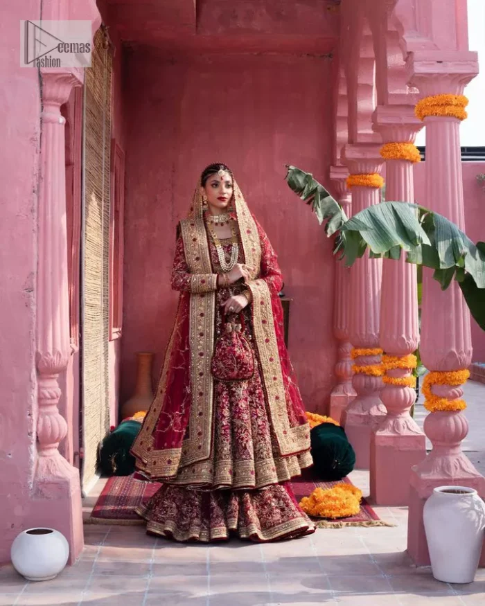 Deep shades of this reception wear just to brighten up your days. The deep red frock is intricately emblazoned with golden embellishments. Red floral designs and threads give an elegant touch to the frock Graceful details of tilla, dabka, kora, Kundan and Zardozi make this beautiful frock a perfect choice to pair with Wedding sharara. The round neckline of the following blouse intensifies the beauty. Furthermore, the full sleeves are decorated with floral patterns. The following deep red frock is coordinated with fish cut sharara having detailed embroidery. Complete this outfit with a dupatta framed with four-sided borders and floral jaal all over.