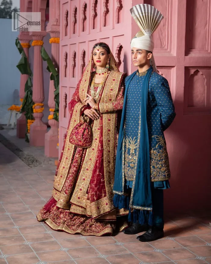 Deep shades of this reception wear just to brighten up your days. The deep red frock is intricately emblazoned with golden embellishments. Red floral designs and threads give an elegant touch to the frock Graceful details of tilla, dabka, kora, Kundan and Zardozi make this beautiful frock a perfect choice to pair with Wedding sharara. The round neckline of the following blouse intensifies the beauty. Furthermore, the full sleeves are decorated with floral patterns. The following deep red frock is coordinated with fish cut sharara having detailed embroidery. Complete this outfit with a dupatta framed with four-sided borders and floral jaal all over.