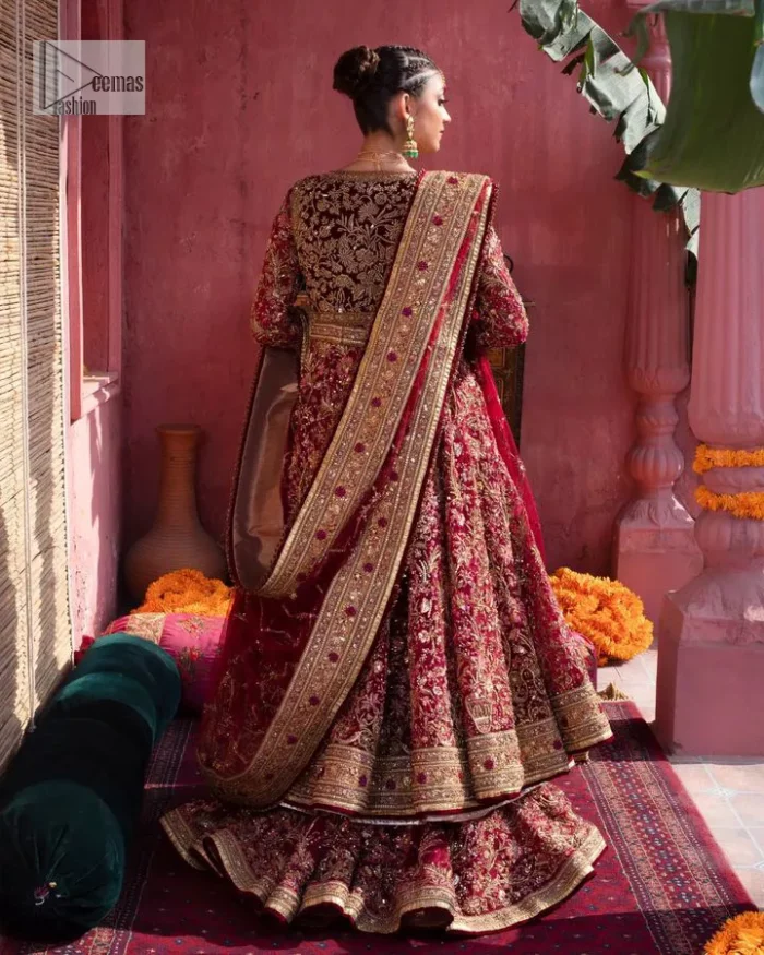 Deep shades of this reception wear just to brighten up your days. The deep red frock is intricately emblazoned with golden embellishments. Red floral designs and threads give an elegant touch to the frock Graceful details of tilla, dabka, kora, Kundan and Zardozi make this beautiful frock a perfect choice to pair with Wedding sharara. The round neckline of the following blouse intensifies the beauty. Furthermore, the full sleeves are decorated with floral patterns. The following deep red frock is coordinated with fish cut sharara having detailed embroidery. Complete this outfit with a dupatta framed with four-sided borders and floral jaal all over.