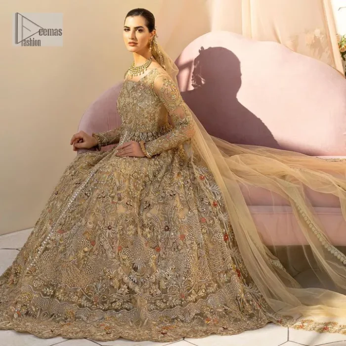 Make a statement wherever you go with a great selection of fawn colours just for you! A beautiful fawn scalloped maxi with a medley of hand-embellished floral motifs and geometric patterns in silver and gold colour. The maxi is enhanced with tilla, dabka, kora, Kundan and the real magic of Zardozi. The V shape neckline makes this walima outfit charming and attractive. Further, the patterns on full sleeves also intensify its loveliness. It is paired with an embellished floral border lehenga served with a scalloped. A net dupatta with sequin spray and intricate borders completes a gorgeous outfit.