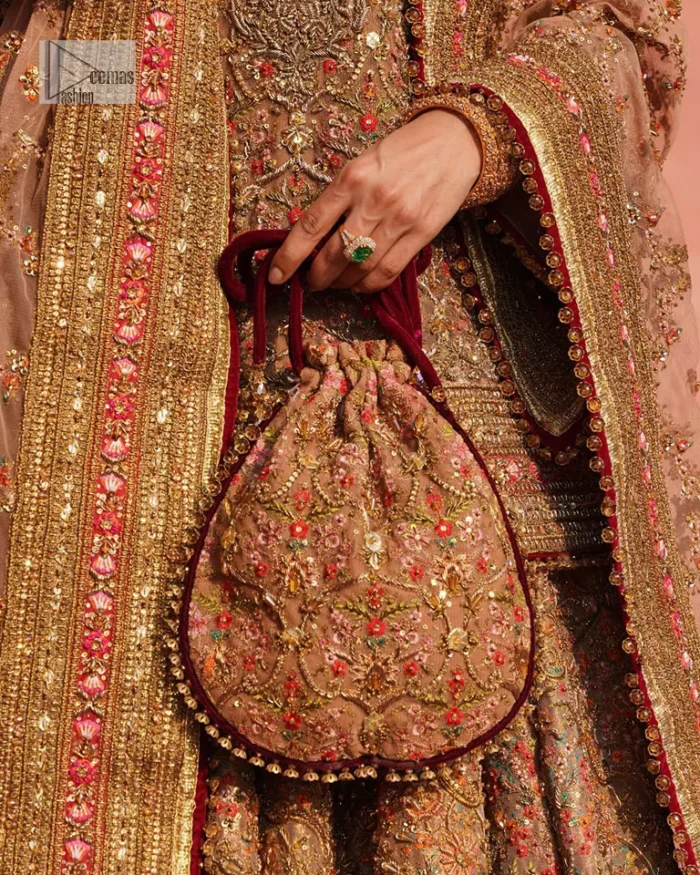 Create a look that’s for you with just one twist of this reception wear. A soft brown short shirt heavily embellished with tilla, dabka, Kora, Zardozi and Kundan. This beautiful dress has Mughal-inspired motifs, geometrical patterns, floral motifs and appliquéd silks. The round neckline makes this masterpiece unique and lovely. In addition to this, the full sleeves also admire its beauty. A lehenga supports it with an embellished border. The organza dupatta has a sequin-sprayed surface with branching floral motifs and it is enveloped with four-sided beautiful borders.