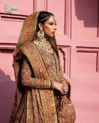 Create a look that’s for you with just one twist of this reception wear. A soft brown short shirt heavily embellished with tilla, dabka, Kora, Zardozi and Kundan. This beautiful dress has Mughal-inspired motifs, geometrical patterns, floral motifs and appliquéd silks. The round neckline makes this masterpiece unique and lovely. In addition to this, the full sleeves also admire its beauty. A lehenga supports it with an embellished border. The organza dupatta has a sequin-sprayed surface with branching floral motifs and it is enveloped with four-sided beautiful borders.