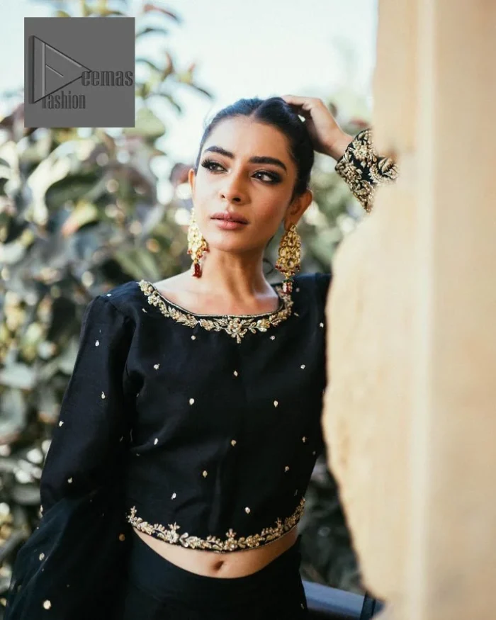 She wears a black colour as her wedding dress and looked stunning on her party event. DeemasFashion presents this outfit in black colour to make your day like a flower. The maxi is adorned with golden embroidery which is further enhanced with tilla, dabka, kora, Kundan and details of crystal to make the masterpiece a unique one. The round neckline of the blouse is also adorned with embroidery for giving a magical look. In addition to this, the full sleeves are also decorated to make your day lovely and charming. Paired up the following blouse with a lehenga having a border embellished. Complete this article with a dupatta framed with fully embellished borders and sequins sprayed all over.