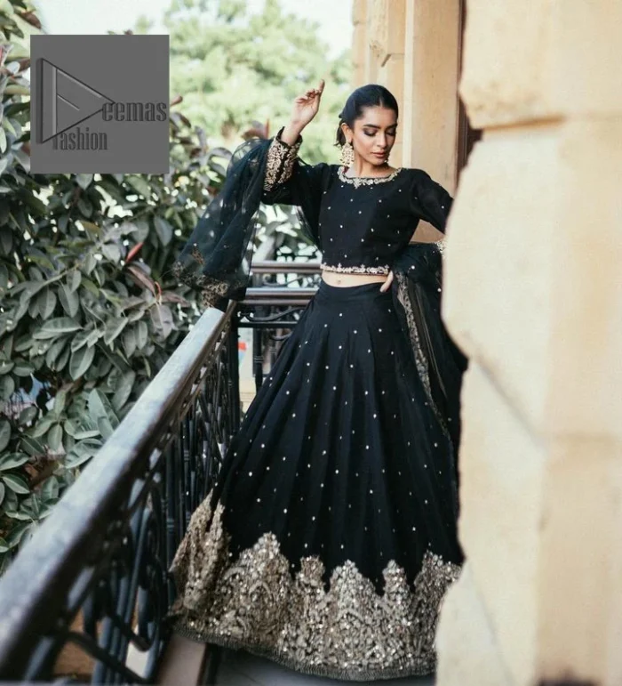 She wears a black colour as her wedding dress and looked stunning on her party event. DeemasFashion presents this outfit in black colour to make your day like a flower. The maxi is adorned with golden embroidery which is further enhanced with tilla, dabka, kora, Kundan and details of crystal to make the masterpiece a unique one. The round neckline of the blouse is also adorned with embroidery for giving a magical look. In addition to this, the full sleeves are also decorated to make your day lovely and charming. Paired up the following blouse with a lehenga having a border embellished. Complete this article with a dupatta framed with fully embellished borders and sequins sprayed all over.