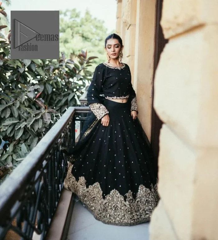 She wears a black colour as her wedding dress and looked stunning on her party event. DeemasFashion presents this outfit in black colour to make your day like a flower. The maxi is adorned with golden embroidery which is further enhanced with tilla, dabka, kora, Kundan and details of crystal to make the masterpiece a unique one. The round neckline of the blouse is also adorned with embroidery for giving a magical look. In addition to this, the full sleeves are also decorated to make your day lovely and charming. Paired up the following blouse with a lehenga having a border embellished. Complete this article with a dupatta framed with fully embellished borders and sequins sprayed all over.