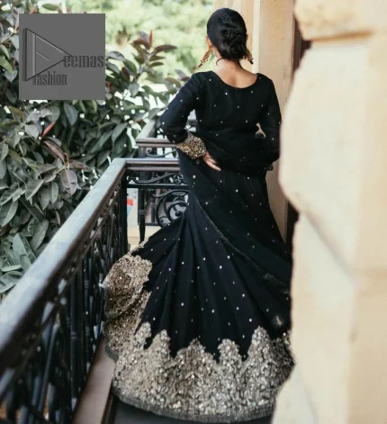 She wears a black colour as her wedding dress and looked stunning on her party event. DeemasFashion presents this outfit in black colour to make your day like a flower. The maxi is adorned with golden embroidery which is further enhanced with tilla, dabka, kora, Kundan and details of crystal to make the masterpiece a unique one. The round neckline of the blouse is also adorned with embroidery for giving a magical look. In addition to this, the full sleeves are also decorated to make your day lovely and charming. Paired up the following blouse with a lehenga having a border embellished. Complete this article with a dupatta framed with fully embellished borders and sequins sprayed all over.