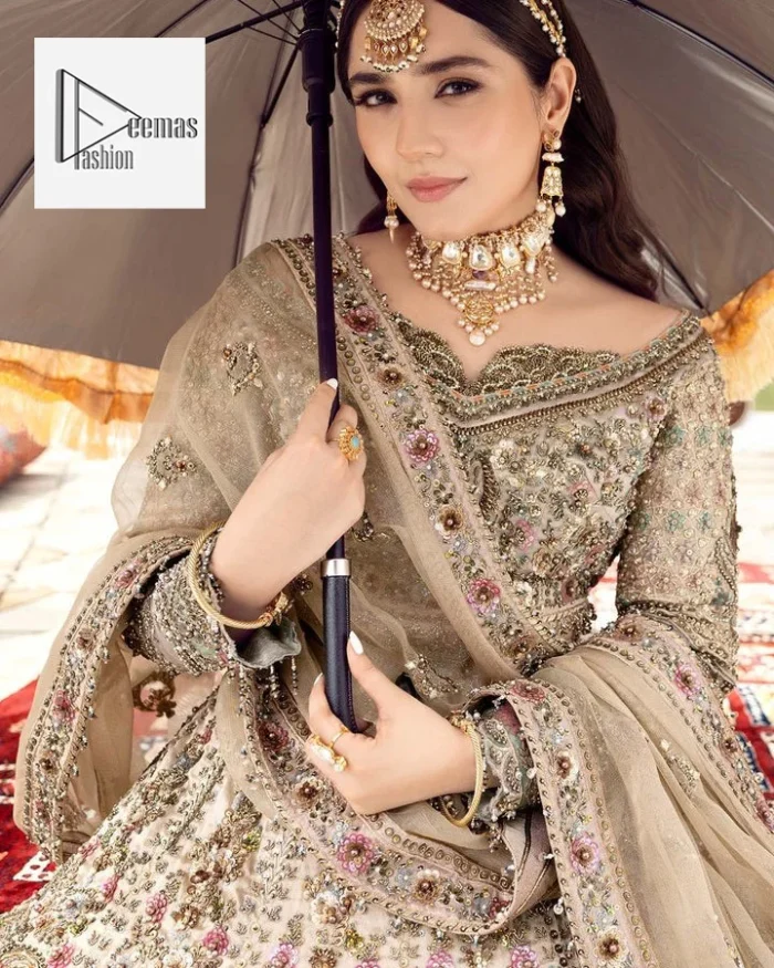 The beautiful floral patterns of this walima wear for versatile you! The?blouse is intricately emblazoned with multiple colour embellishments. Beautiful floral designs on the neckline and full sleeves give an elegant touch to the blouse. It is paired up with a flared lehenga having heavy embroidery to make your day as bright as the colour of the outfit. Graceful details of tilla, resham, sequins, and stones make this beautiful outfit a perfect choice. Complete this outfit with a dupatta framed with four-sided borders and tiny floral motifs all over to make your day versatile and charming.