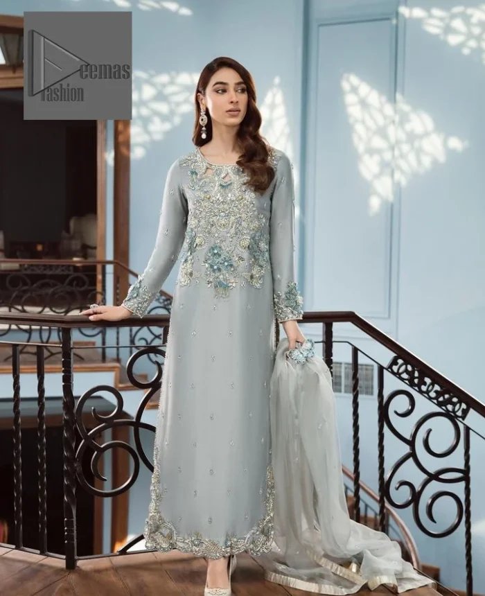 Timeless details that add an extra edge to your looks! Deemas Fashion presents this Party outfit, an embellished masterpiece that wins everyone’s hearts at first glance with its charm and elegance. The shirt in the Gray colour is laden with golden and teal embroidery, making this attire a head-turning masterpiece. Further, the round neckline is fully embellished with tilla, dabka, kora, Kundan, and pearls that give it a magical look. The full-sleeved style makes this outfit a little attractive but super charming. Complete this article with a dupatta, having a tiny floral motif all over to give you a decent look.