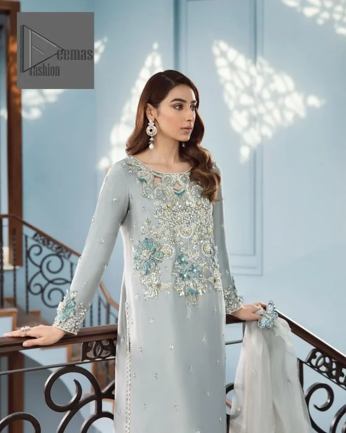 Timeless details that add an extra edge to your looks! Deemas Fashion presents this Party outfit, an embellished masterpiece that wins everyone’s hearts at first glance with its charm and elegance. The shirt in the Gray colour is laden with golden and teal embroidery, making this attire a head-turning masterpiece. Further, the round neckline is fully embellished with tilla, dabka, kora, Kundan, and pearls that give it a magical look. The full-sleeved style makes this outfit a little attractive but super charming. Complete this article with a dupatta, having a tiny floral motif all over to give you a decent look.