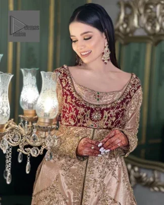 Your words about your special day is expertly written in this beautiful dress. This ivory front open gown is the picture of elegance and majesty. Silver dabka, pearls, tilla, kora, Kundan, zardozi, and the true magic of beads are used to embellish the stunning garment. Golden embroidery on it makes it stand out. The V-shaped neckline of the dress elevates this ensemble. Moreover, full sleeves are embellished with the lovely embroidery. Pairing the richly embroidered ivory gown with a set of simple frilled lehenga and inner frock would look stunning. To achieve professional magic, it is set up with a dupatta that is bordered with four-sided borders and spray of sequins all over.