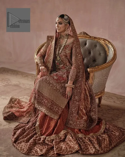 Red is utilised as the dress base colour. The sleeves of the blouse are embellished with floral patterns to make