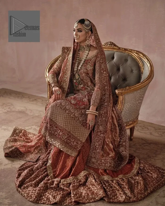Red is utilised as the dress base colour. The sleeves of the blouse are embellished with floral patterns to make this reception wear the epitome of beauty.