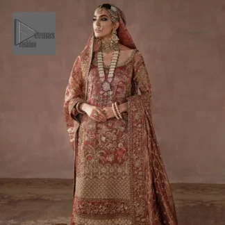 The boat-shaped neckline enhances the appeal and attractiveness of the outfit when worn with a lehenga. The golden embroidery on the outfit is complemented by tilla, dabka, kora, Kundan, and the true enchantment of Zardozi.