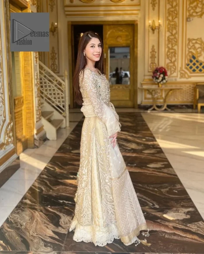 Bringing in the Nikah spirit with some flowers. Exquisite nikkah long shirt dress in pale green colour with silver pearl, sequin, kora, dabka, tilla, Zardozi, and Kundan embroidery accents. The embroidery on the whole length of the sleeves is done in flowery designs. This masterpiece is extremely special and endearing because of the boat shape neckline. The inner blouse of the beautiful outfit is embellished with embroidery. Also, the trousers makes it a wonderful match for the dupatta. In order to balance the entire ensemble, it is arranged with a dupatta.
