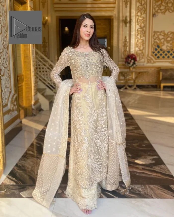 Bringing in the Nikah spirit with some flowers. Exquisite nikkah long shirt dress in pale green colour with silver pearl, sequin, kora, dabka, tilla, Zardozi, and Kundan embroidery accents. The embroidery on the whole length of the sleeves is done in flowery designs. This masterpiece is extremely special and endearing because of the boat shape neckline. The inner blouse of the beautiful outfit is embellished with embroidery. Also, the trousers makes it a wonderful match for the dupatta. In order to balance the entire ensemble, it is arranged with a dupatta.