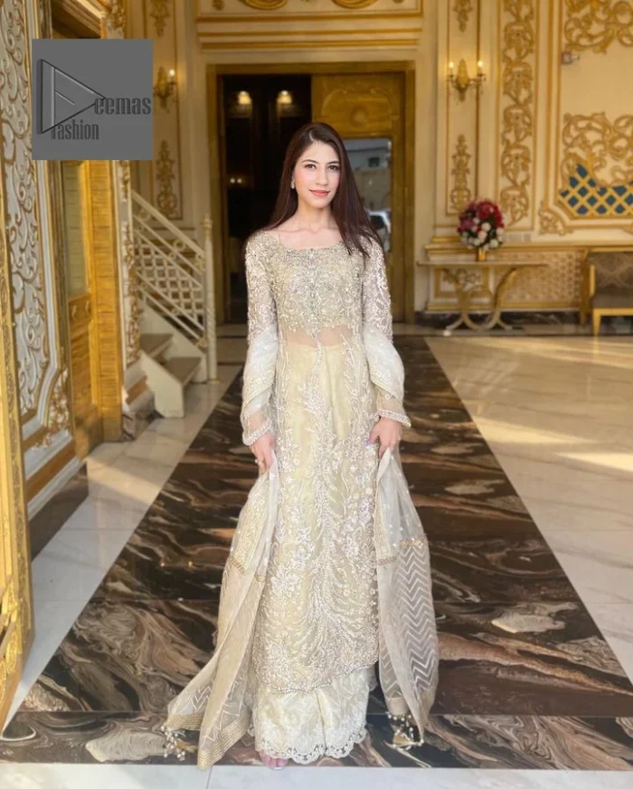 Bringing in the Nikah spirit with some flowers. Exquisite nikkah long shirt dress in pale green colour with silver pearl, sequin, kora, dabka, tilla, Zardozi, and Kundan embroidery accents. The embroidery on the whole length of the sleeves is done in flowery designs. This masterpiece is extremely special and endearing because of the boat shape neckline. The inner blouse of the beautiful outfit is embellished with embroidery. Also, the trousers makes it a wonderful match for the dupatta. In order to balance the entire ensemble, it is arranged with a dupatta.