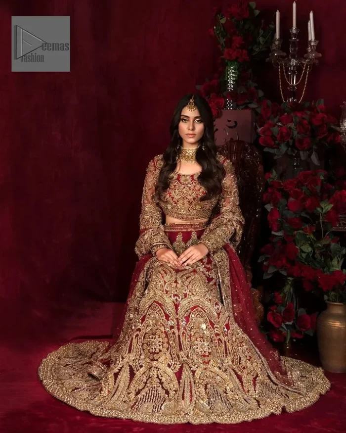 Further, it comes with a full-sleeve style to give a royal touch. Its round neckline is just the epitome of grace. It is paired up with a lehenga in the same color having heavy embellishments to make a true statement.