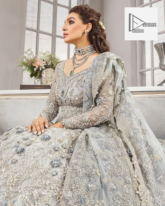 The full sleeves are covered with attractive geometrical patterns. Further, the V-shaped neckline is beautifully decorated with tilla, dabka, kora, Kundan and the real magic of Zardozi.