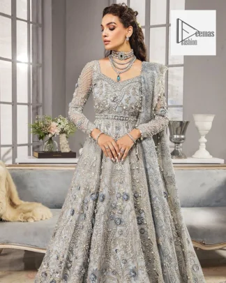 Awe-inspiring embellishments on luxurious Gray canvas for an ultra-bride look on nikkah. A Gray flared maxi, heavily hand embellished with floral branches and botanical motifs.