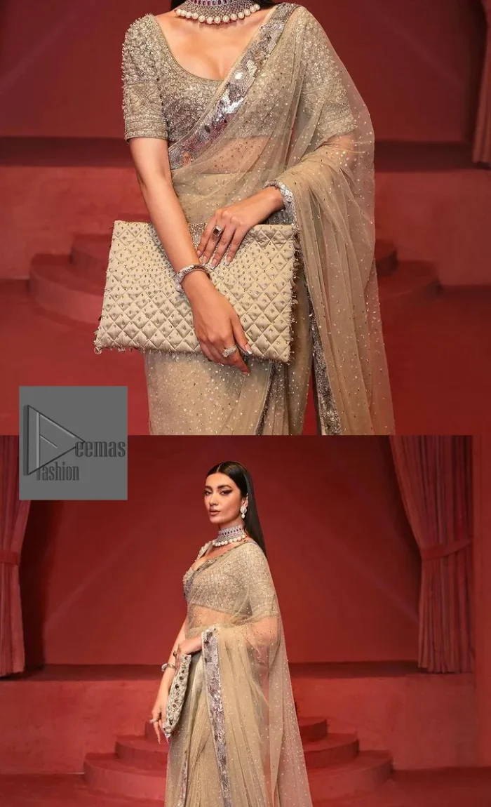 It is paired up with a saree in the same color having sequins spray all over to make a true statement.