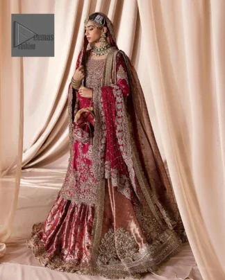 The maroon color is the perfect feminine and delicate shade with its meticulously crafted untruth The gorgeous shirt is embellished with tilla, dabka, kora, Kundan, and Zardozi. The colour of the embroidery is gold. Everyone is captivated by the shirt’s boat shape neckline. Moreover, the shirt’s three quarter sleeves are embellished with floral designs. It is coordinated with scalloped lehenga having beautiful border embellished. Complete this outfit with dupatta framed with a four sided embellished scalloped borders